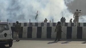 Indian farmers smashes barricades at Ghazipur, police fires tear gas