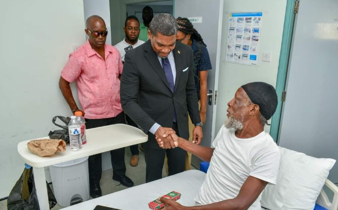 The prime minister greeted and distributed gifts to the patients in Joseph N France Gen Hospital. (Credits: Terrance Drew, Facebook)