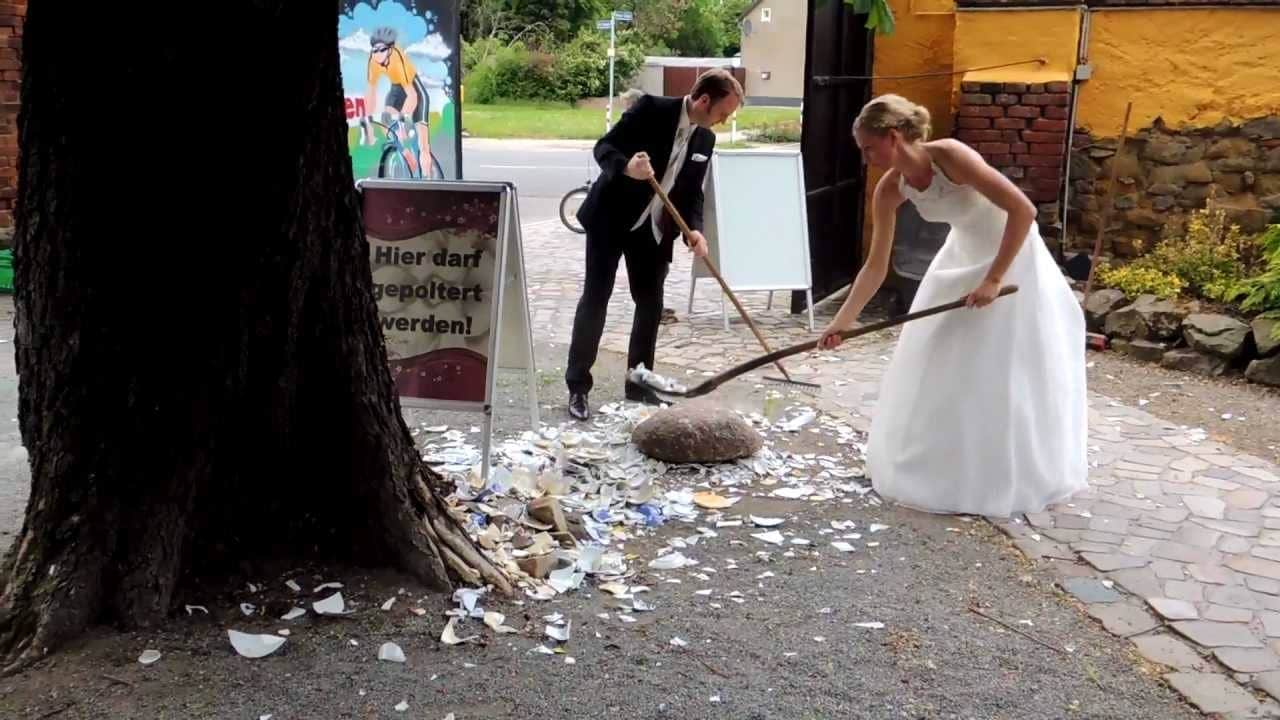 Bride and Groom clearing the mess during the Polteraband Custom. (Credits: Ria Money Transfer Australia & New Zealand, Facebook)