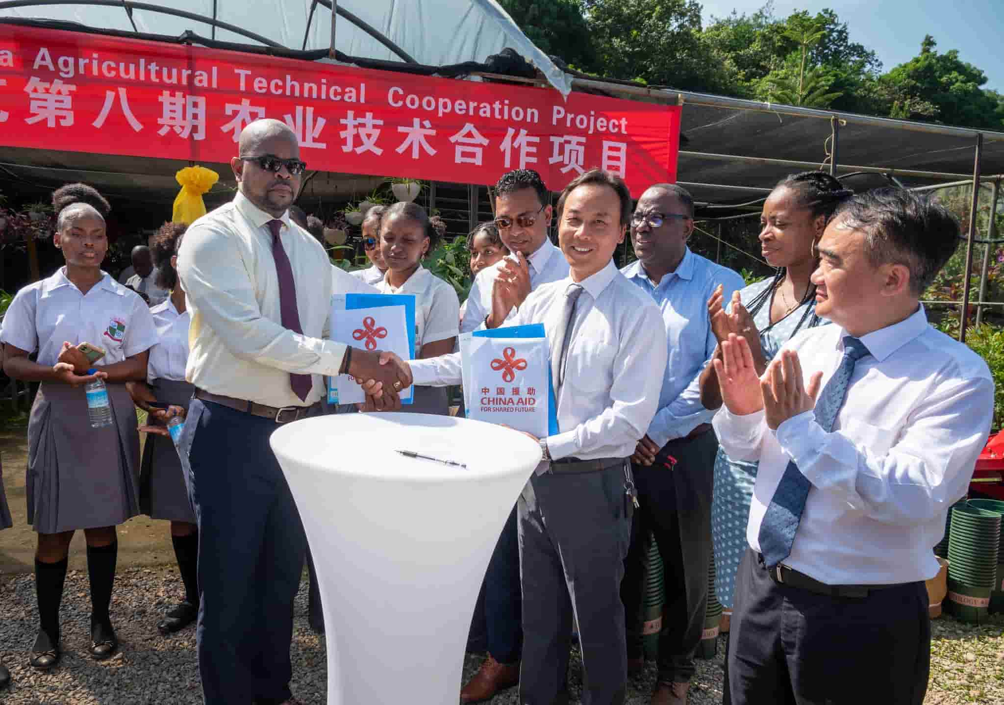 Government officials received agricultural aid from China. (Credits: Roosevelt Skerrit, Facebook)