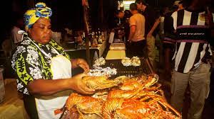 Vendors preparing fish on the streets. (Credits: St Lucia News Now, Facebook)