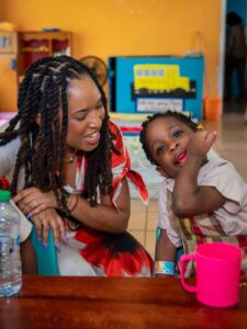 Diani Jimesha Prince Drew with the children of pre school, credits to Facebook