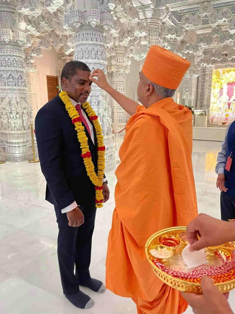 PM Terrance Drew with Brahmavihari Swami, credits to Facebook