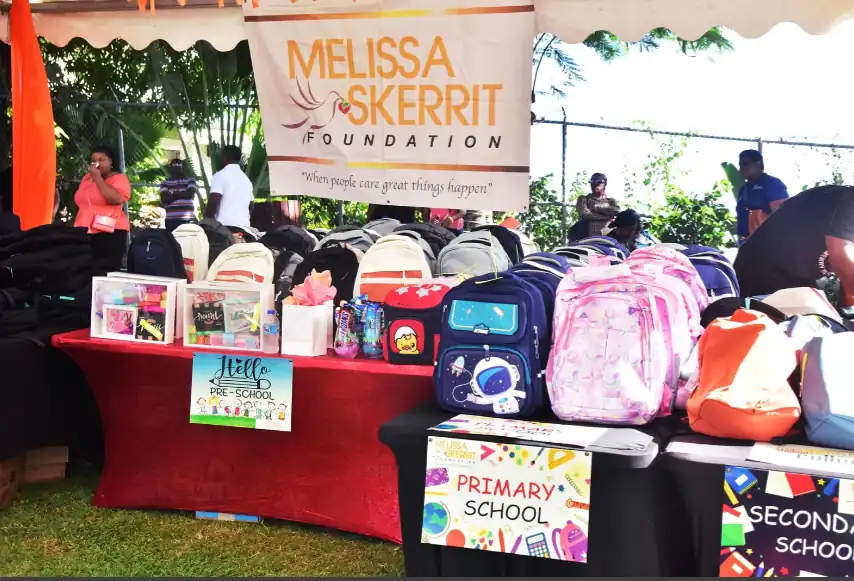 Minister Melissa Skerrit hands over around 276 packages filled with essential supplies during back to school program 